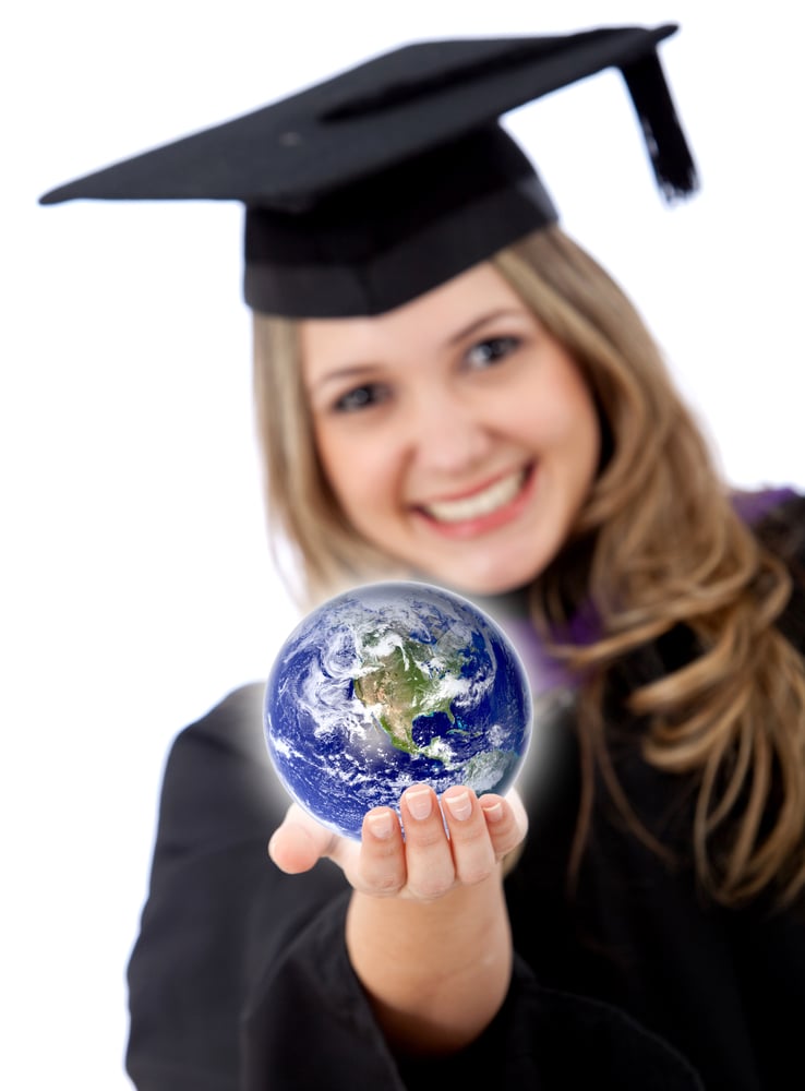 Female graduate with the world in her hands isolated over white-1
